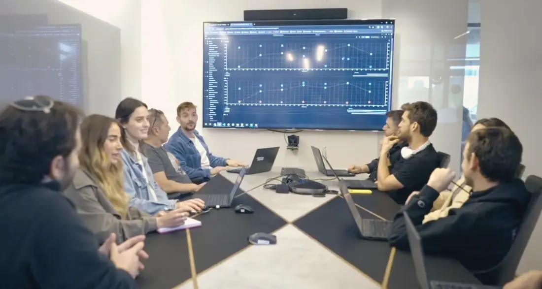 Vitaly Chait working with a technical team in a laboratory