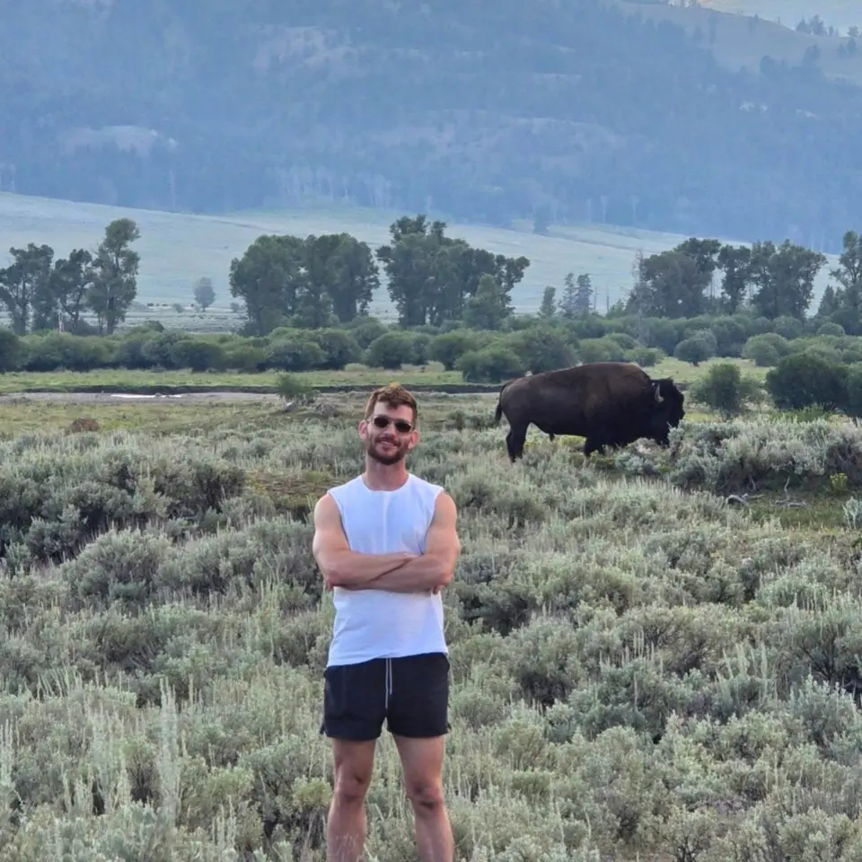 Vitaly Chait outdoors in a mountain landscape